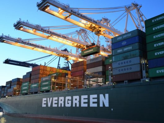 evergreen cargo ship docked at cargo bay