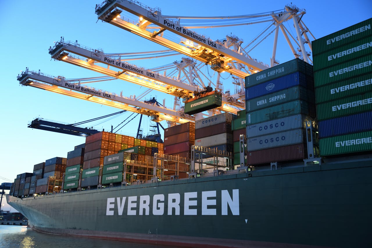 evergreen cargo ship docked at cargo bay